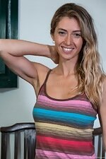 Julia Blanche wears her rainbow dress on her table