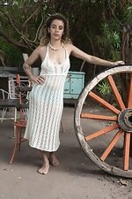 Lula strips naked outside by her wooden wheel